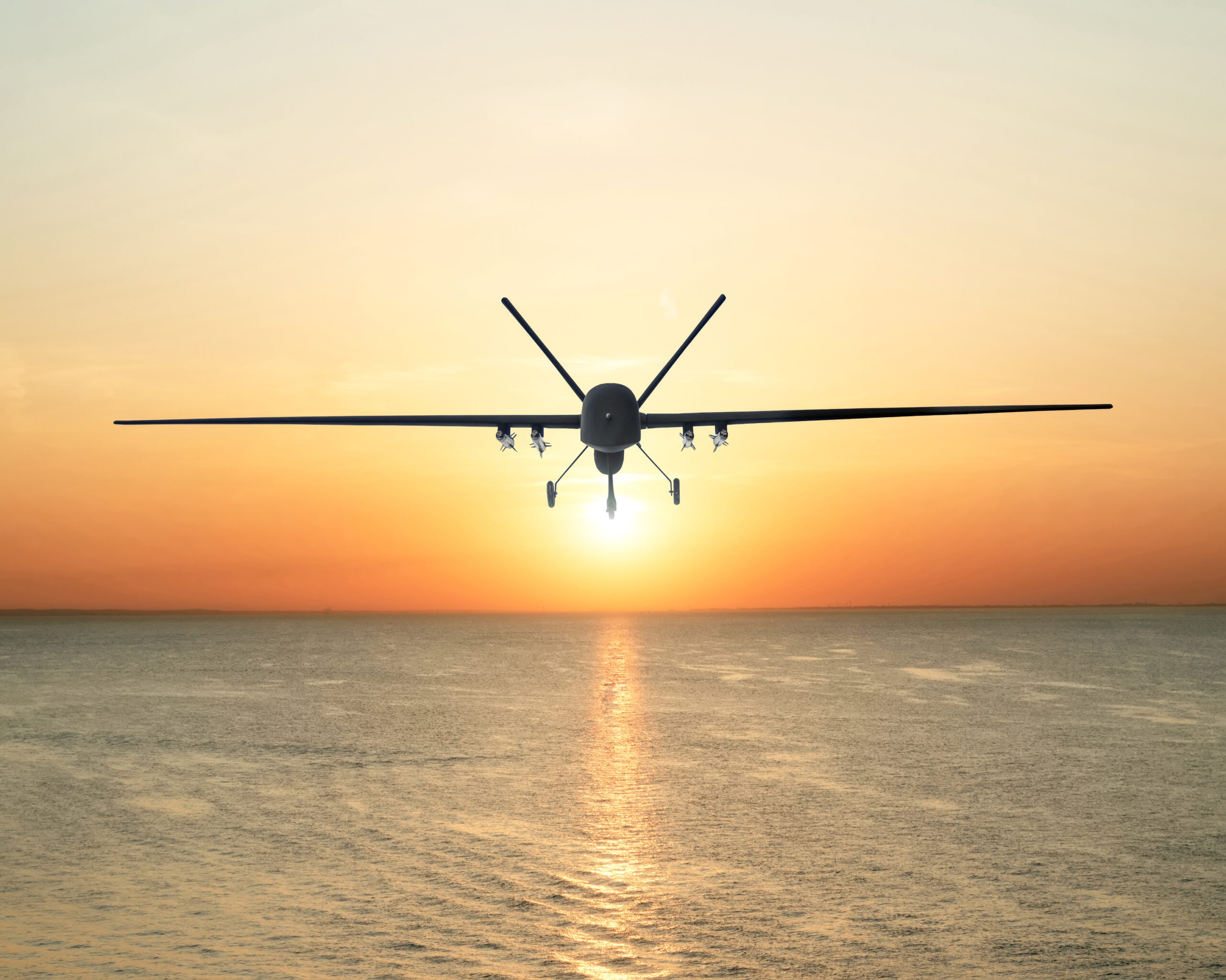 Unmanned,Military,Drone,Patrols,The,Territory,At,Sunset,,Flying,Above